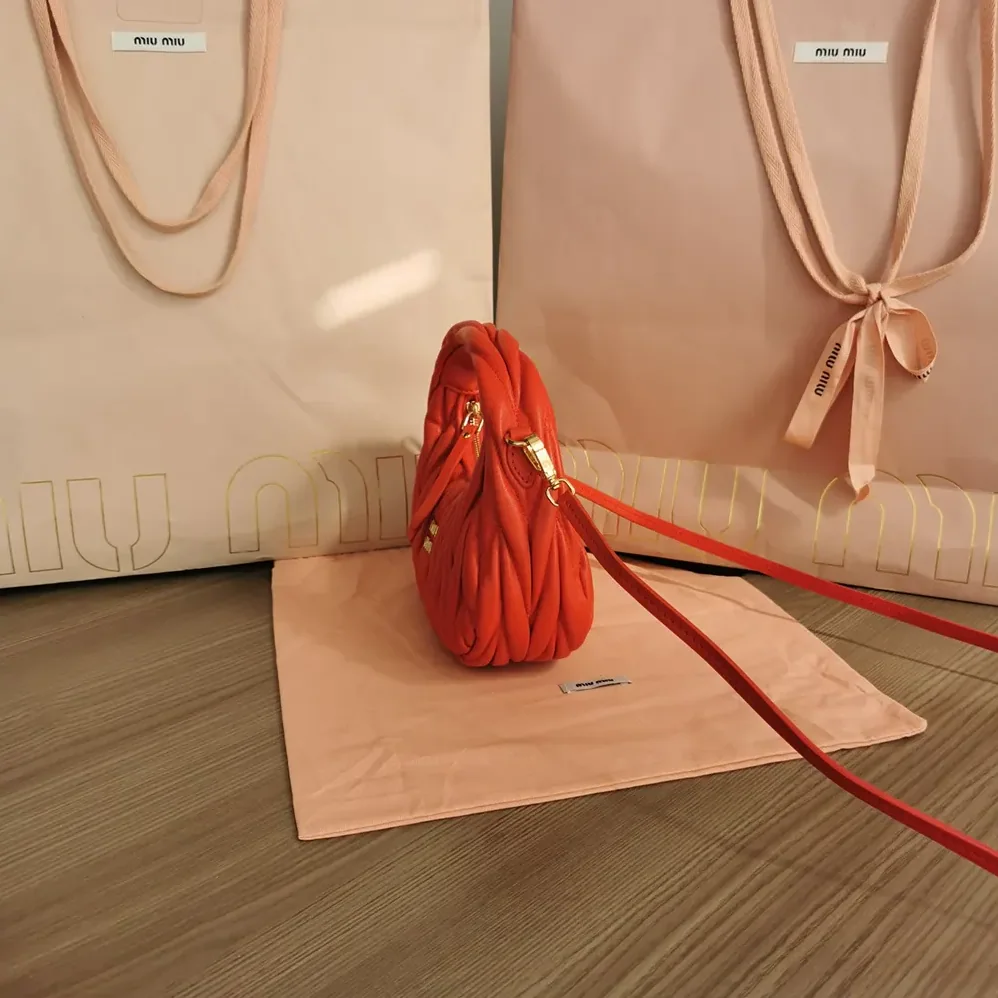 Miu Miu Wander Matelassé Nappa Leather Hobo Mini-Bag for Women in Red Miu Miu Wander Matelassé Nappa Leather Hobo Mini-Bag for Women in Red
