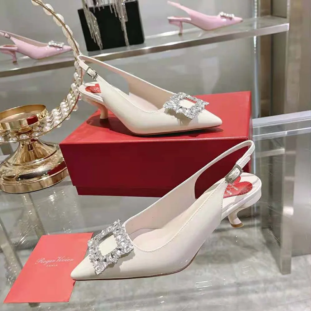 Roger Vivier Virgule Strass Buckle Slingback Pumps in Patent Leather for Women in White Roger Vivier Virgule Strass Buckle Slingback Pumps in Patent Leather for Women in White