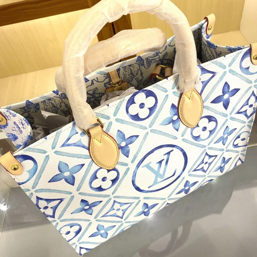 Louis Vuitton OnTheGo MM Tote Bag in Blue Gold Hardware