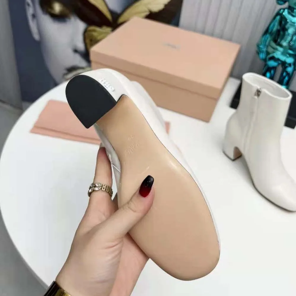Miu Miu Leather Booties with Metal Lettering Logo for Women in White