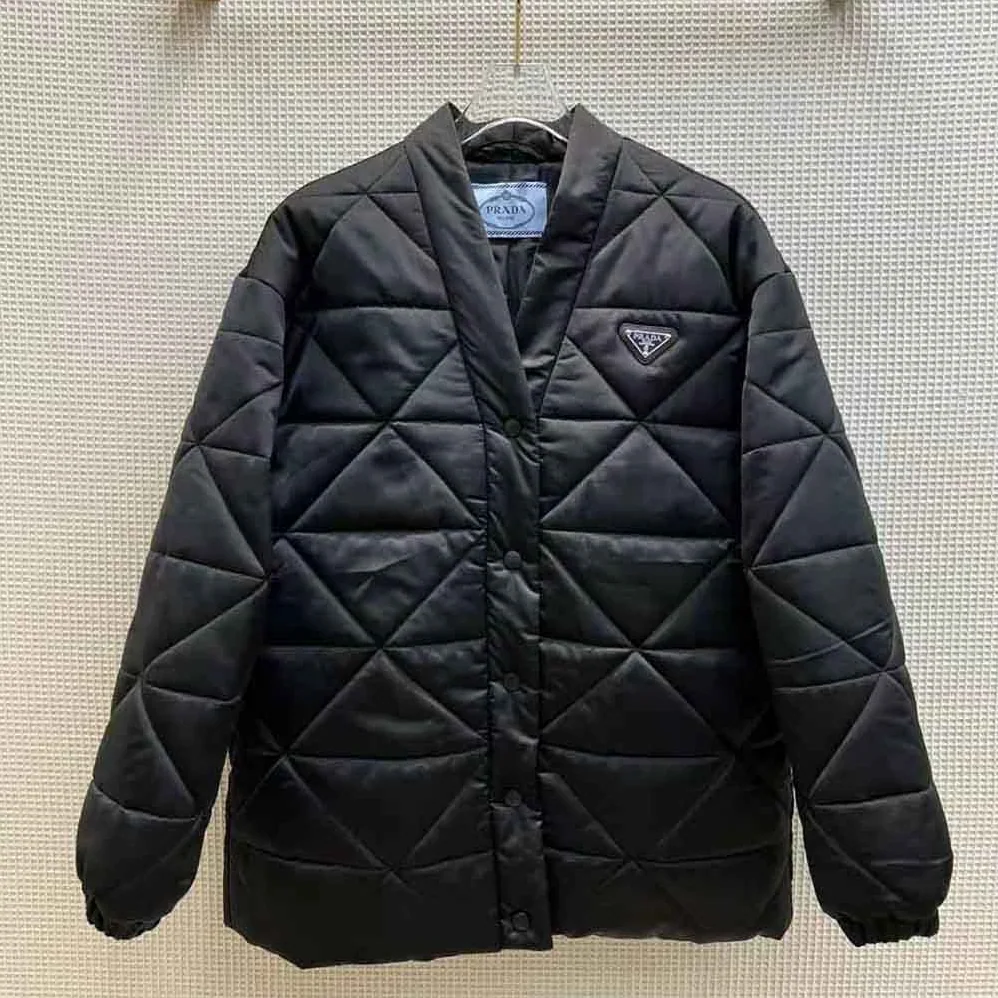 Prada Emblematic Triangle Quilted Re-Nylon Jacket for Women in Black Prada Emblematic Triangle Quilted Re-Nylon Jacket for Women in Black