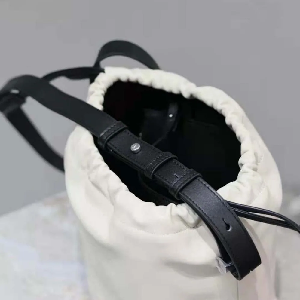 Saint Laurent YSL Rive Gauche Laced Bucket Bag in Smooth Leather for Men in Beige