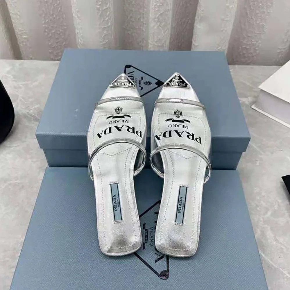 Prada Logo-Print Plexiglas Slides for Women in Silver Prada Logo-Print Plexiglas Slides for Women in Silver