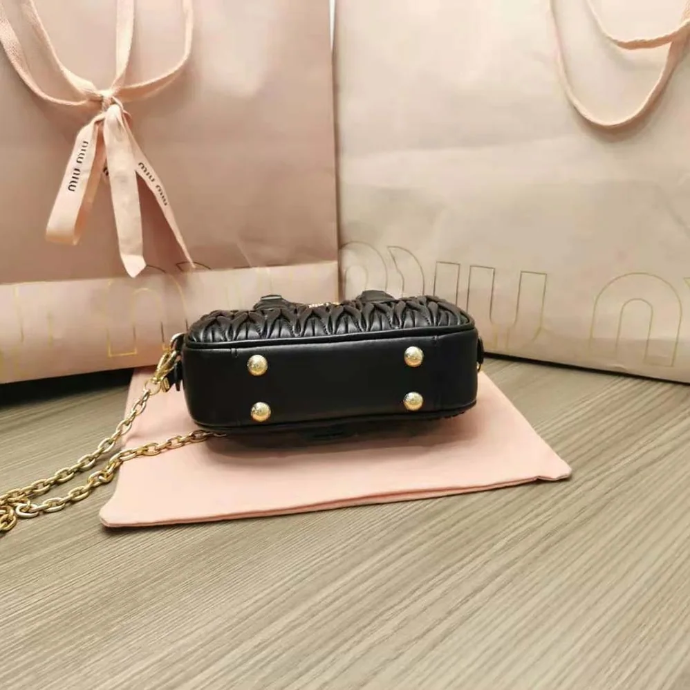 Miu Miu Matelassé Nappa Leather Top-Handle Mini-Bag for Women in Black Miu Miu Matelassé Nappa Leather Top-Handle Mini-Bag for Women in Black