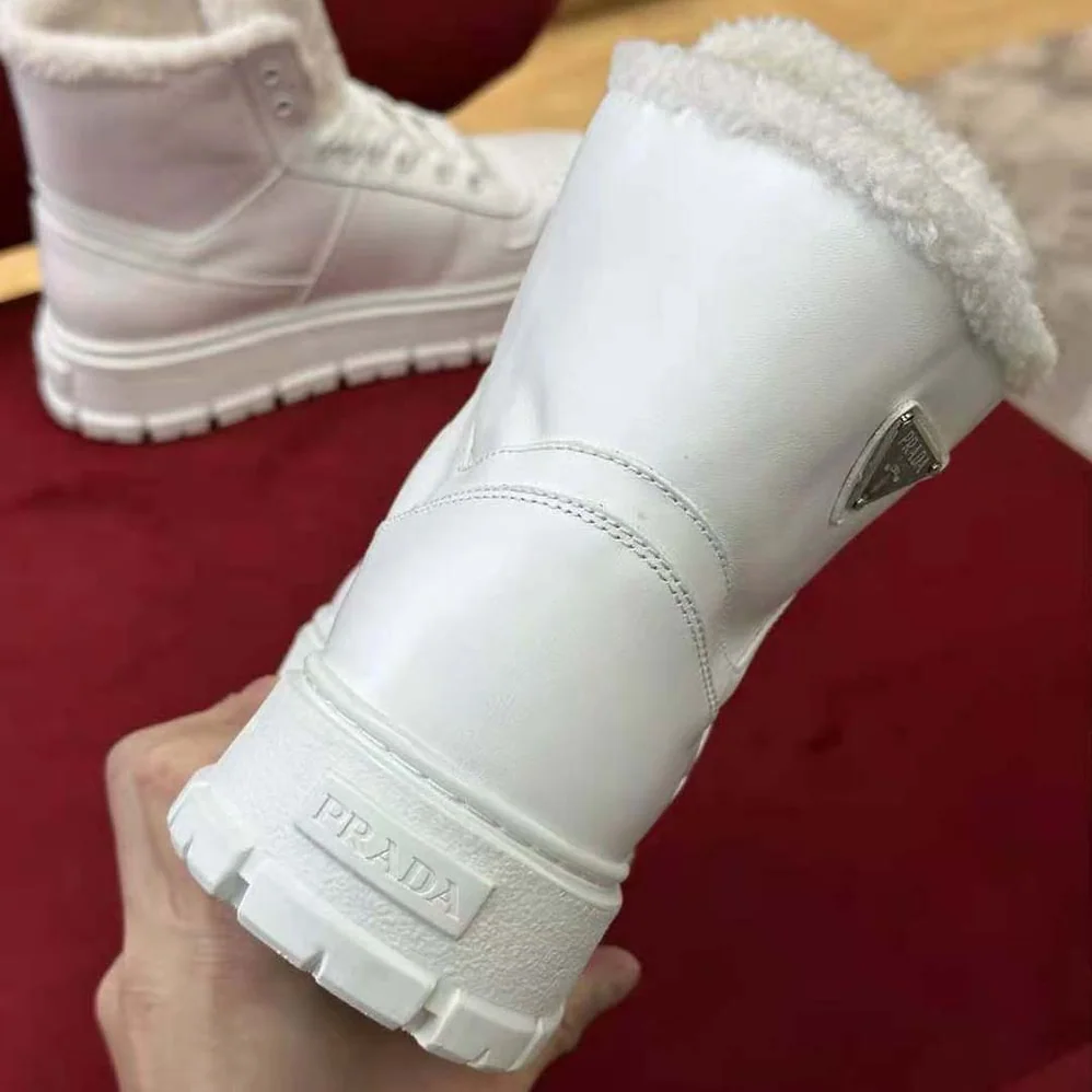 Prada Leather and Shearling High-Top Sneakers for Women in White Prada Leather and Shearling High-Top Sneakers for Women in White