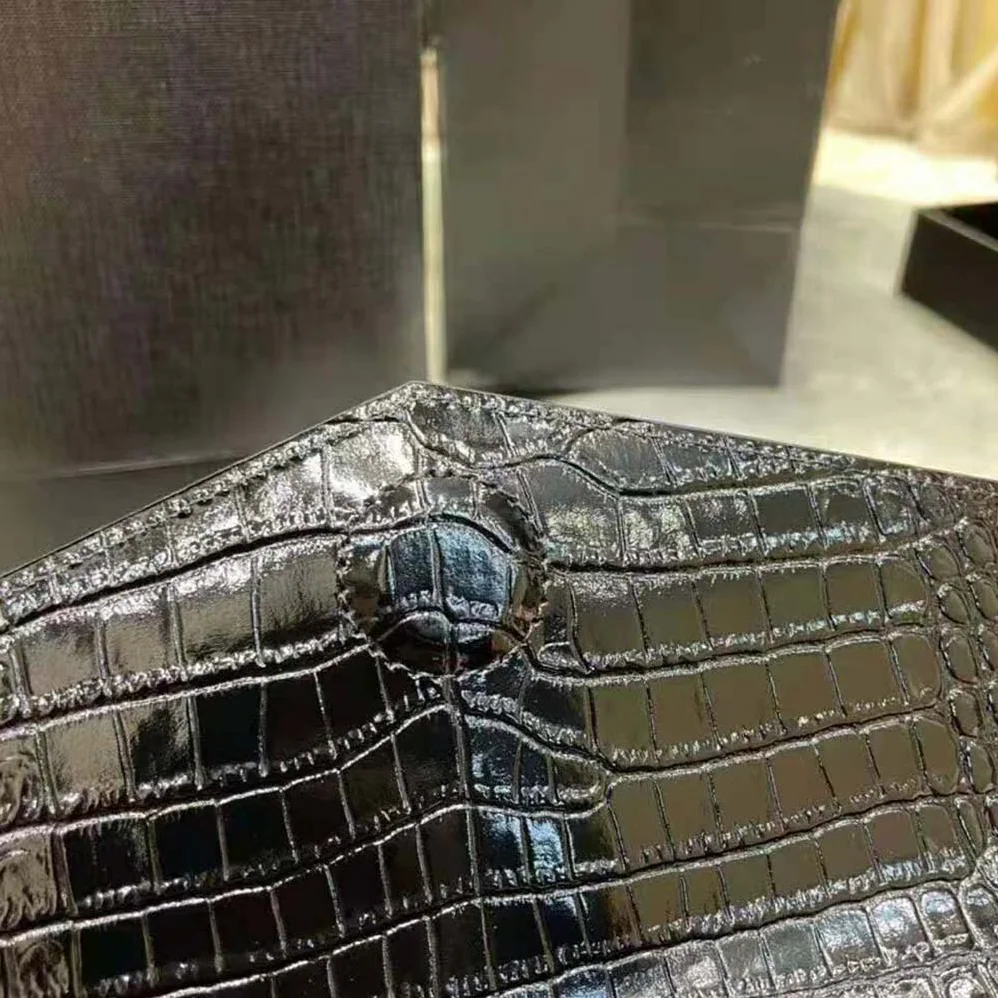 Saint Laurent YSL Uptown Pouch in Crocodile Embossed Shiny Leather for Women in Silver
