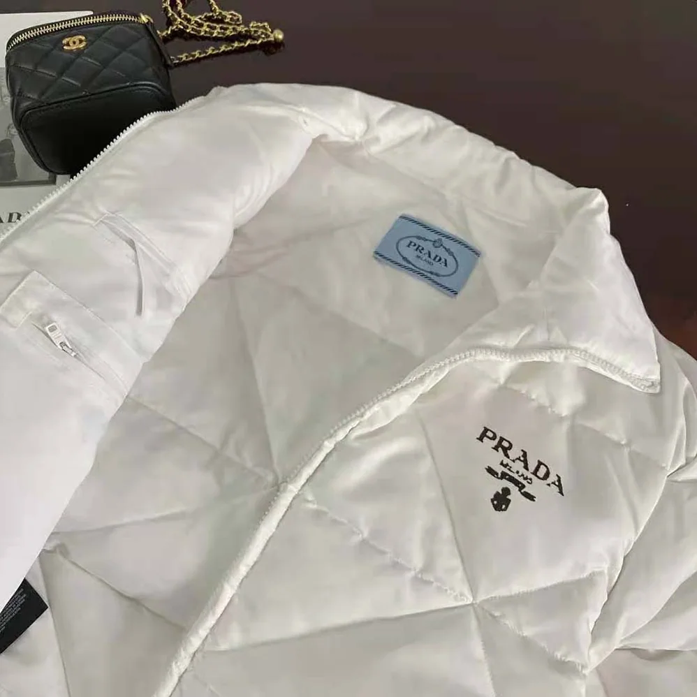 Prada Re-Nylon Gabardine Cropped Down Jacket for Women in White Prada Re-Nylon Gabardine Cropped Down Jacket for Women in White