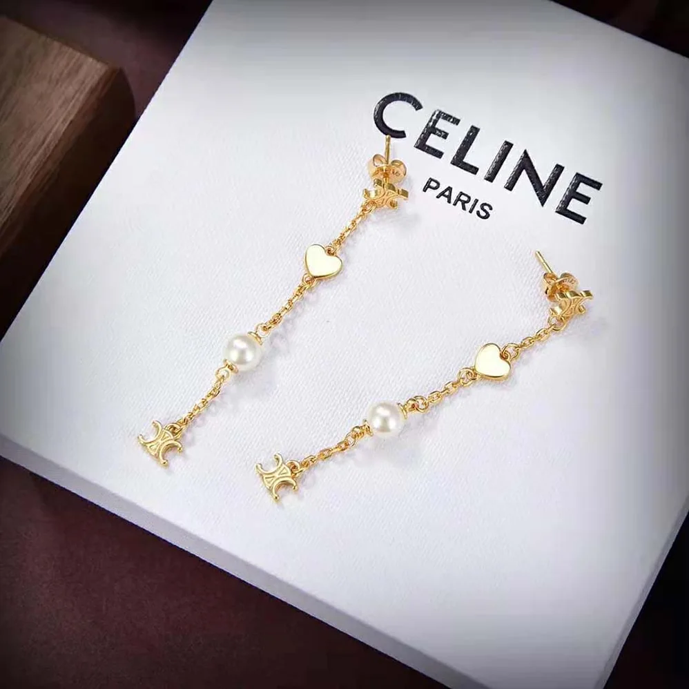 Celine Cœur Celine Charms Earrings in Brass with Gold Finish and Resin Pearl for Women Celine Cœur Celine Charms Earrings in Brass with Gold Finish and Resin Pearl for Women