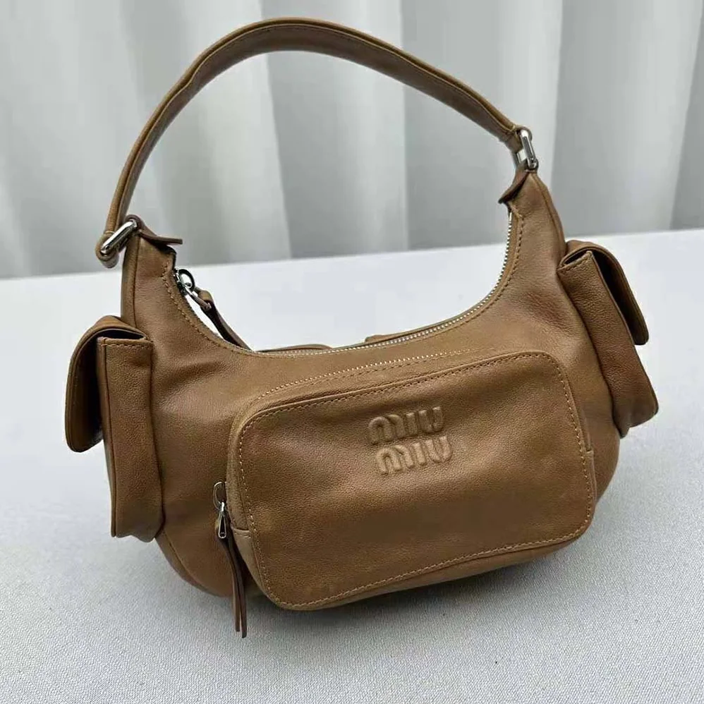 Miu Miu Pocket Nappa Leather Bag with Embossed Lettering Logo for Women in Brown Miu Miu Pocket Nappa Leather Bag with Embossed Lettering Logo for Women in Brown
