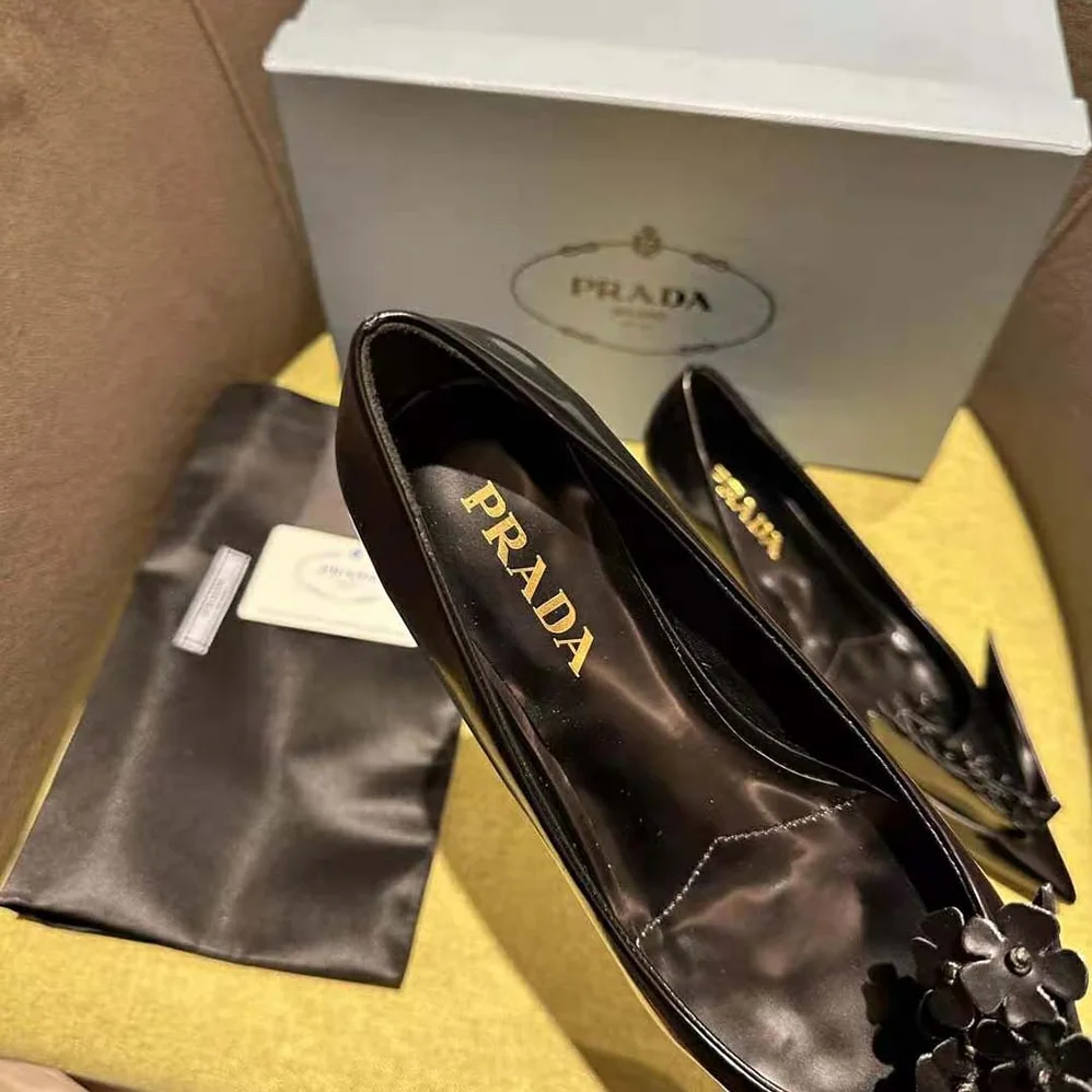 Prada Brushed Leather Pumps with Floral Appliqués for Women in Black