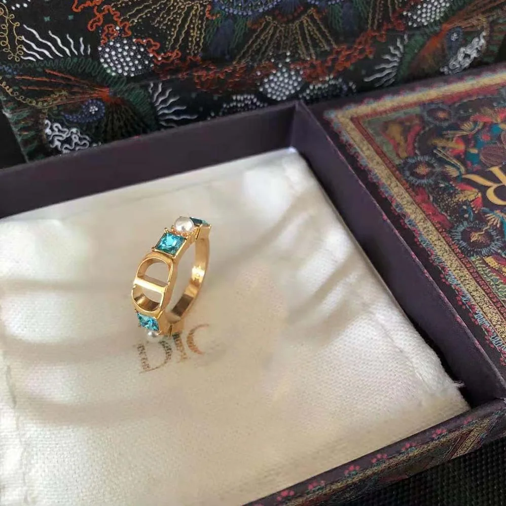 Dior Petit CD Ring Gold-Finish Metal with White Resin Pearls and Light Blue Crystals for Women Dior Petit CD Ring Gold-Finish Metal with White Resin Pearls and Light Blue Crystals for Women