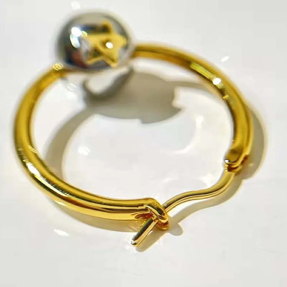 Dior Petit CD Earrings Gold-Finish and Palladium for Women in Finish Metal Dior Petit CD Earrings Gold-Finish and Palladium for Women in Finish Metal