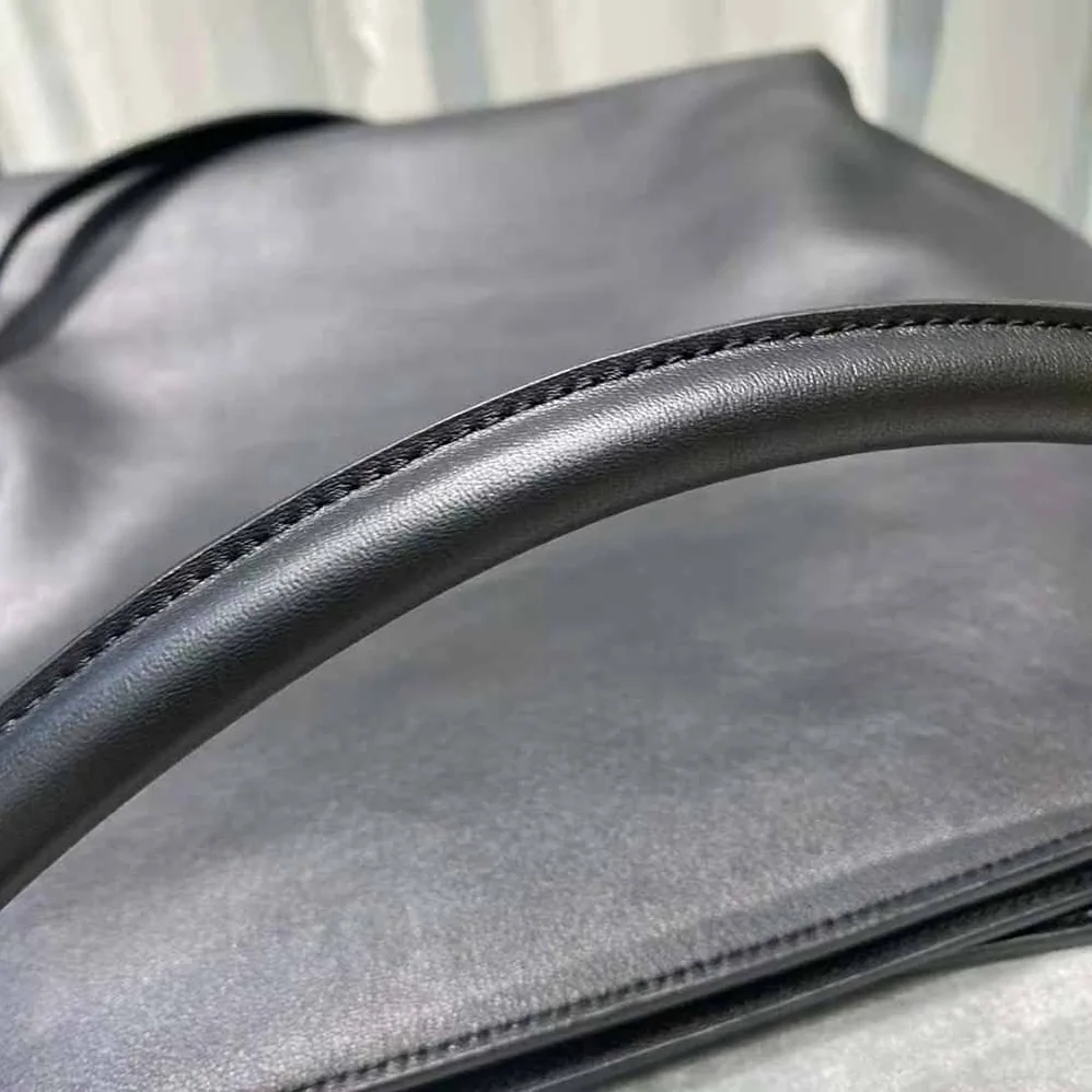 Saint Laurent YSL Tag Hobo Bag in Smooth Saddle Leather for Women in Black