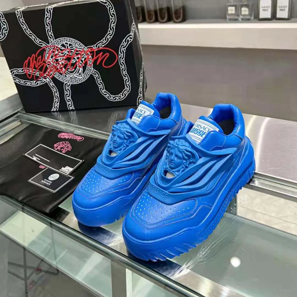 Versace Odissea Sneakers are Set on Rubber Soles with Perforated Toe Caps for Unisex in Blue Versace Odissea Sneakers are Set on Rubber Soles with Perforated Toe Caps for Unisex in Blue