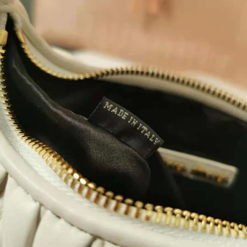 Miu Miu Wander Matelassé Nappa Leather Hobo Bag for Women in White Miu Miu Wander Matelassé Nappa Leather Hobo Bag for Women in White