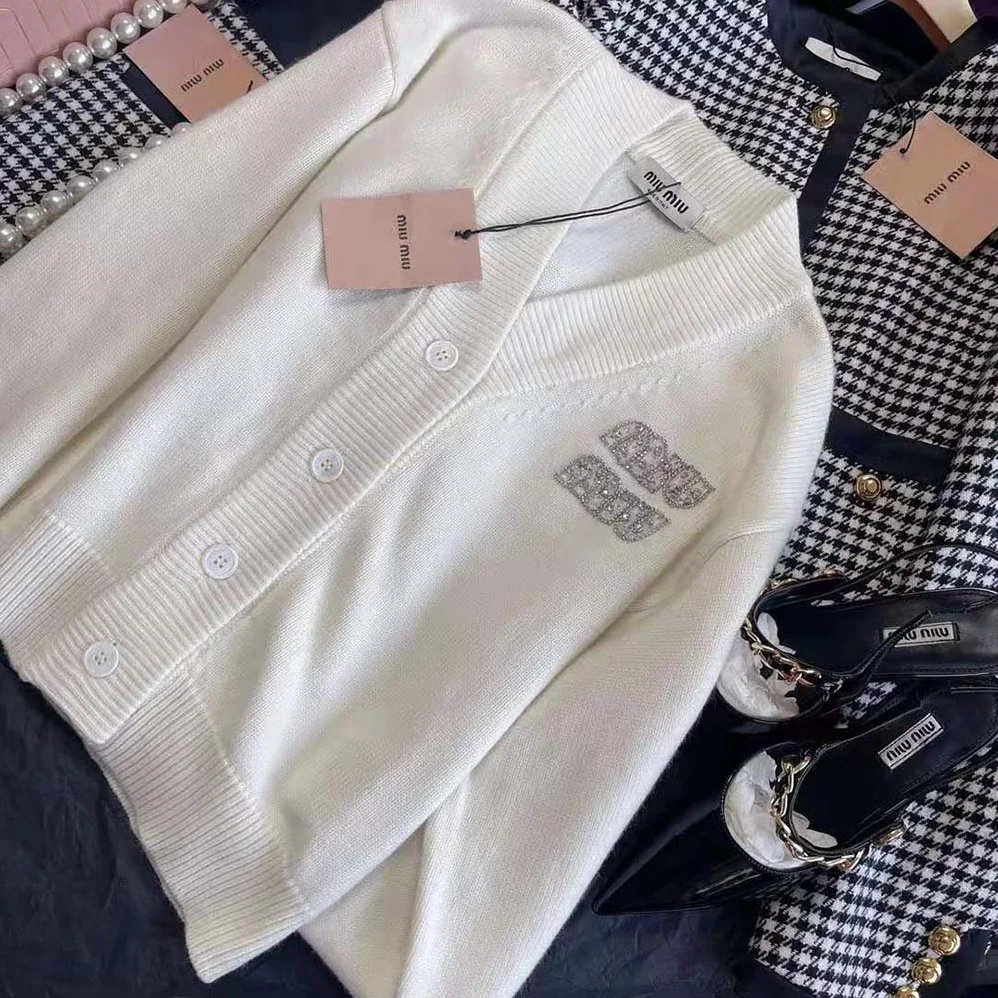 Miu Miu Cashmere Cardigan Features an Embroidered Logo for Women in White Miu Miu Cashmere Cardigan Features an Embroidered Logo for Women in White