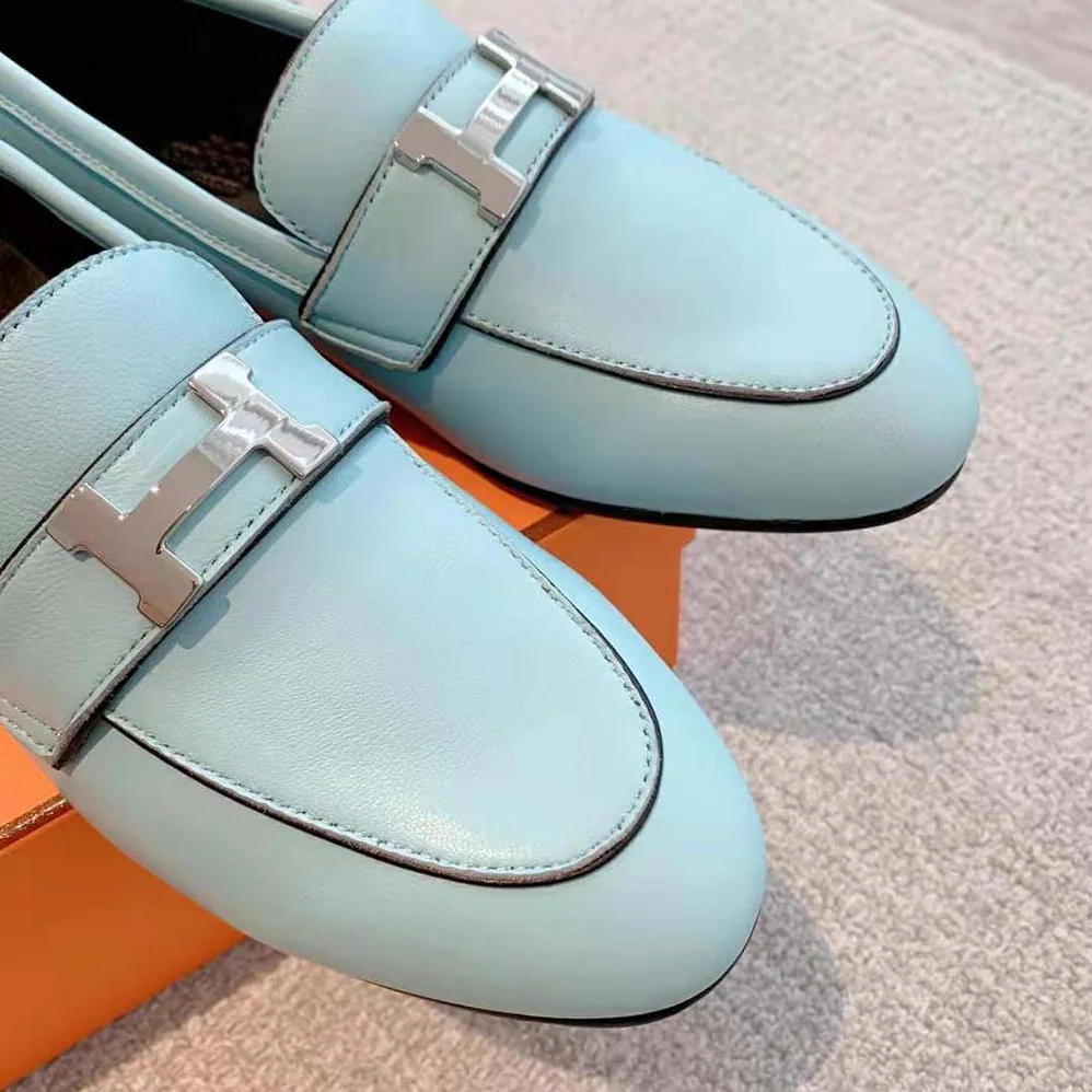 Hermes Paris Loafer in Calfskin with Palladium Plated Signature “H” Detail for Women in Blue Hermes Paris Loafer in Calfskin with Palladium Plated Signature “H” Detail for Women in Blue