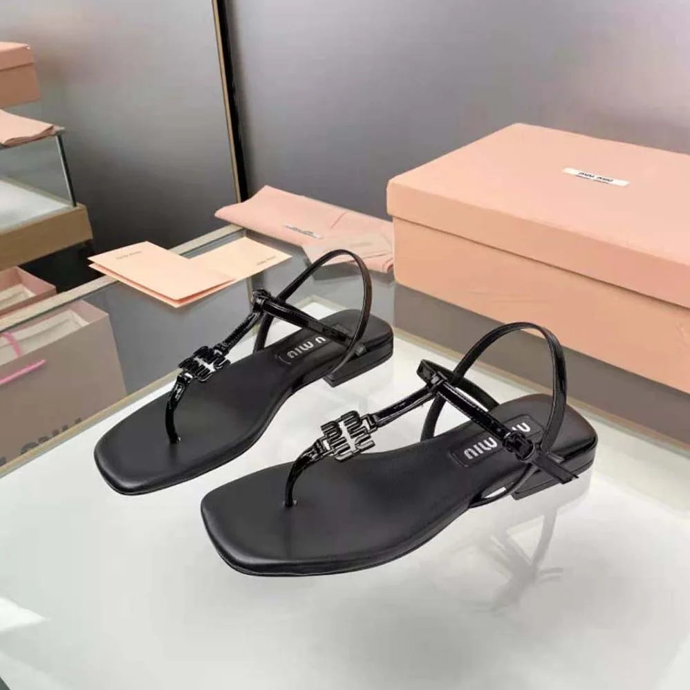 Miu Miu Patent Thong Sandals with Metal Lettering Logo for Women in Black Miu Miu Patent Thong Sandals with Metal Lettering Logo for Women in Black
