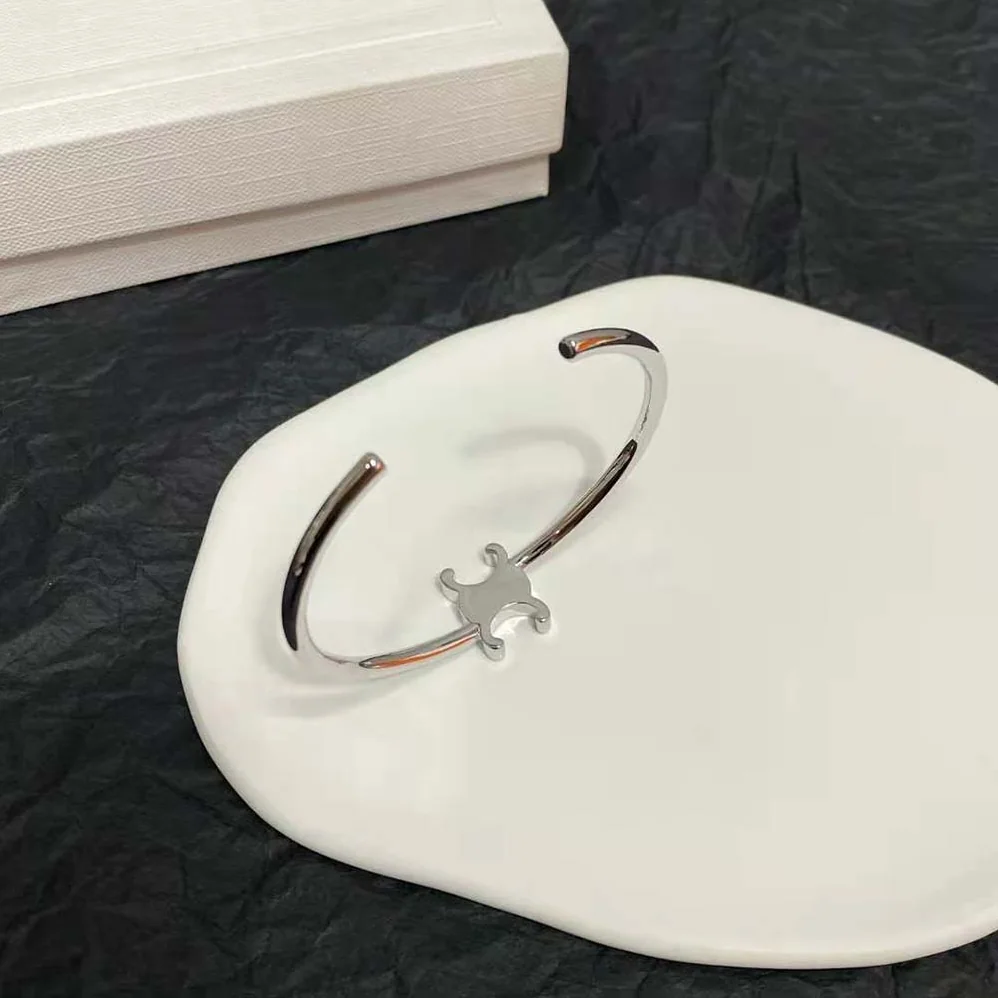 Celine Triomphe Asymmetric Cuff in Brass with Rhodium Finish for Women