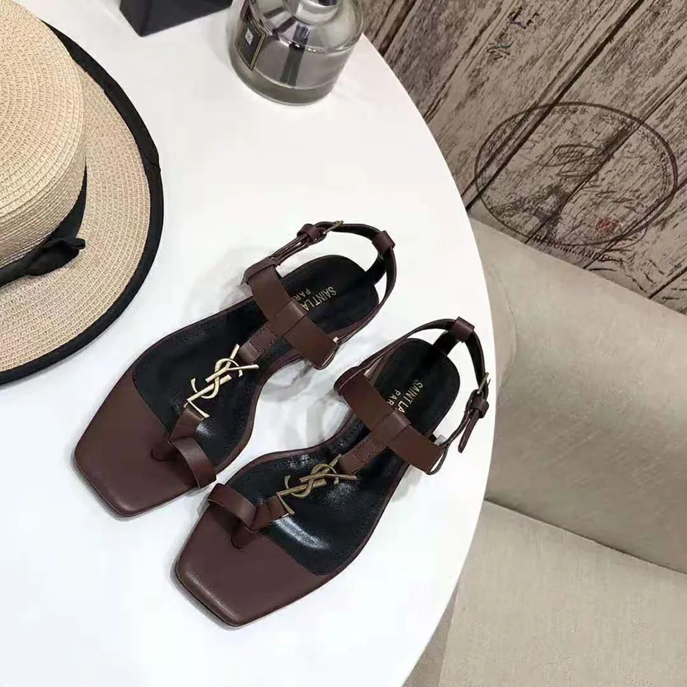 Saint Laurent YSL Cassandra Flat Sandals in Smooth Leather with Gold-Tone Monogram for Women in Brown