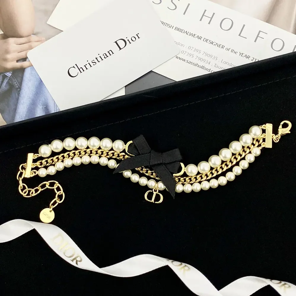 Dior Le Nœud de Dior Bracelet Gold-Finish Metal with White Resin Pearls and Black Satin for Women Dior Le Nœud de Dior Bracelet Gold-Finish Metal with White Resin Pearls and Black Satin for Women