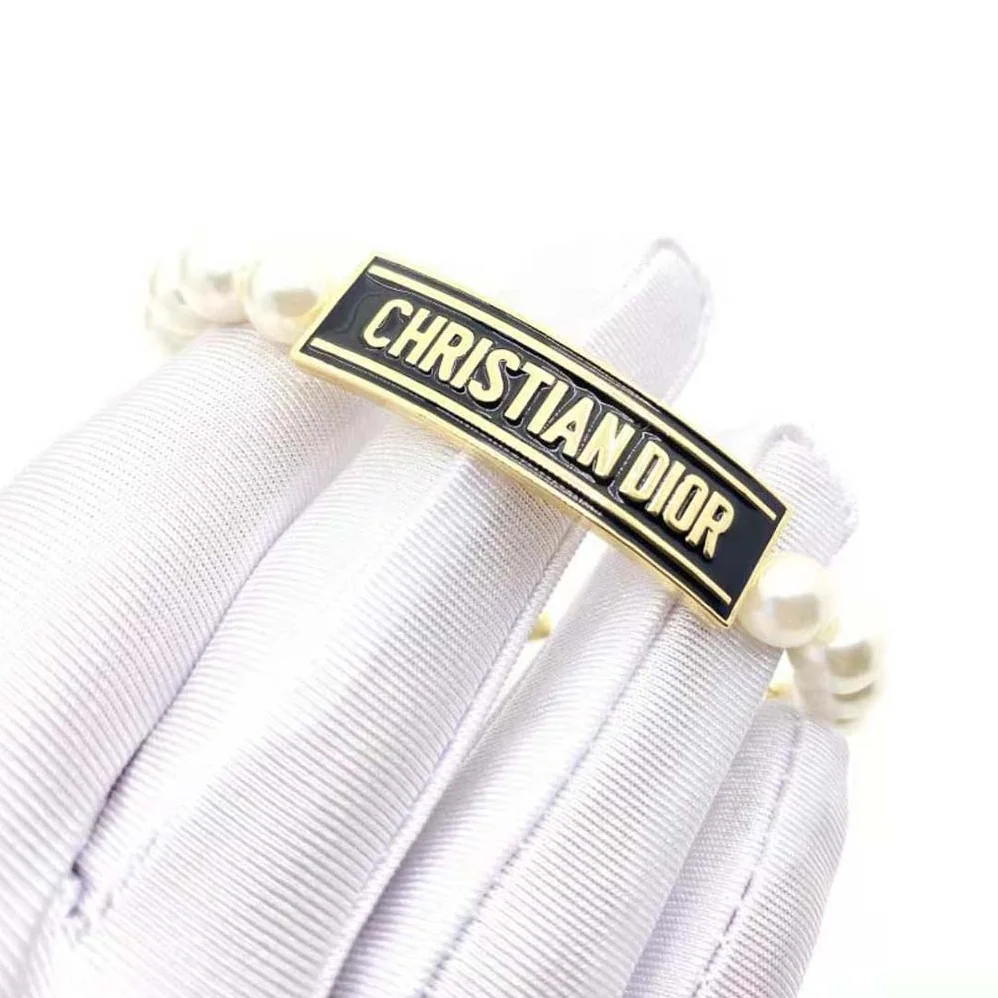 Dior Dior-id Bracelet Gold-Finish Metal with White Resin Pearls and Black Lacquer for Women Dior Dior-id Bracelet Gold-Finish Metal with White Resin Pearls and Black Lacquer for Women