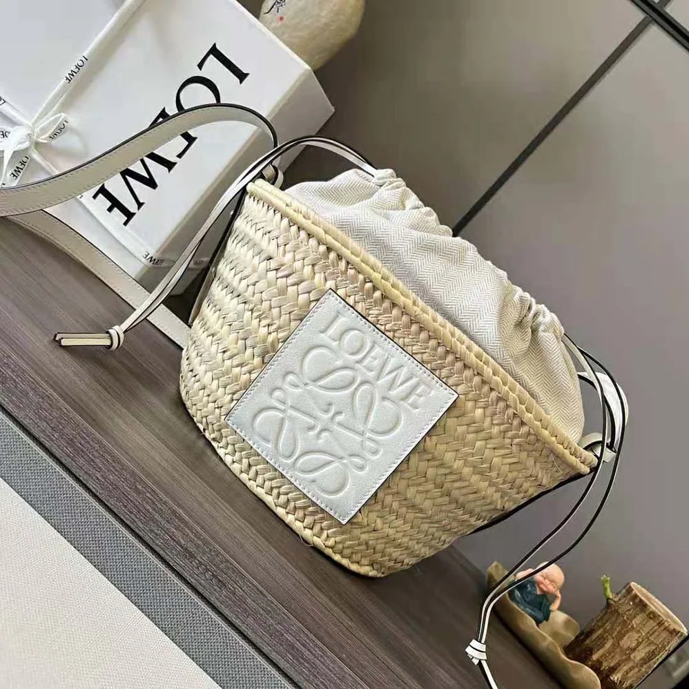 Loewe Drawstring Bucket Bag in Palm Leaf and Calfskin for Women in White Loewe Drawstring Bucket Bag in Palm Leaf and Calfskin for Women in White