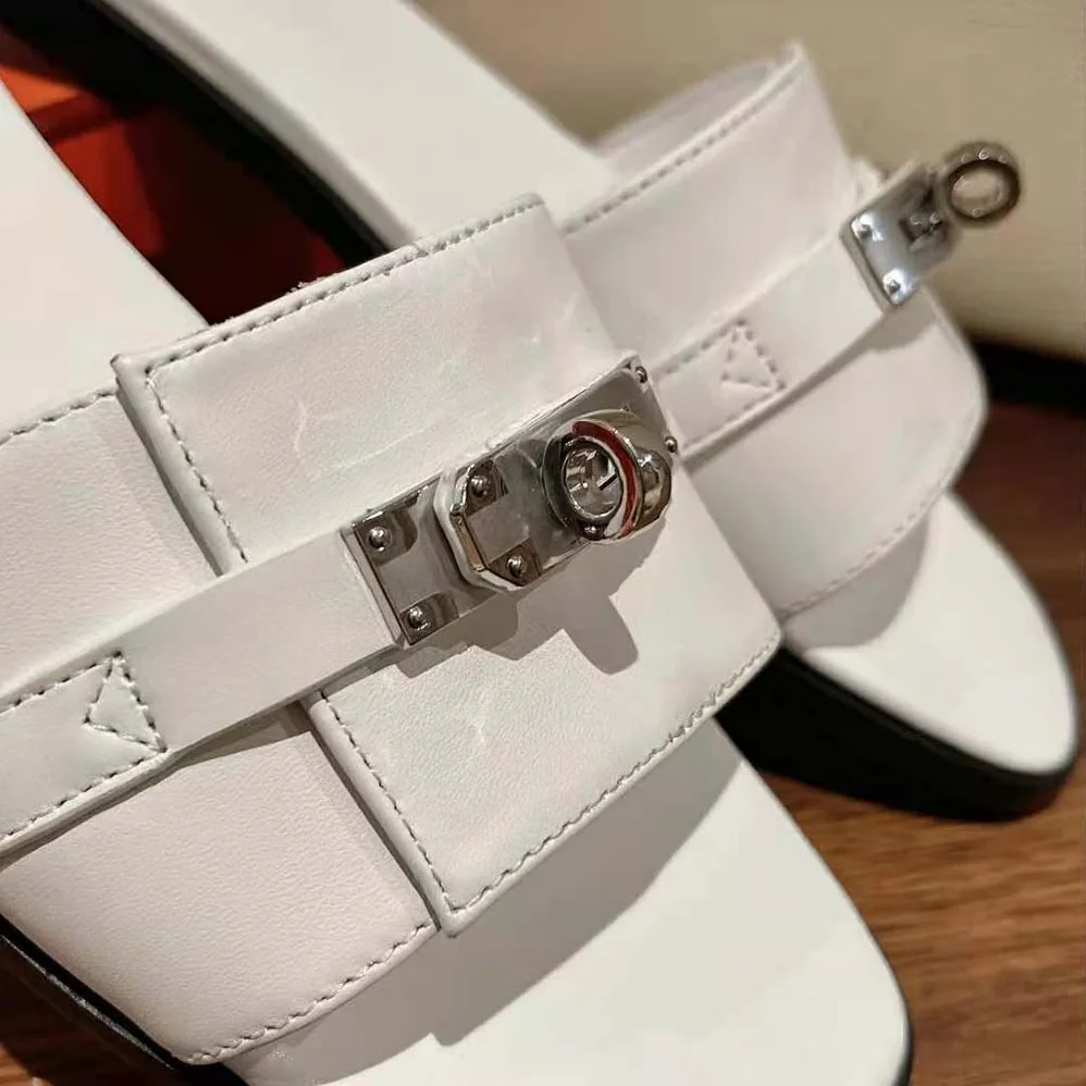 Hermes Giulia Sandal in Calfskin with Iconic Palladium-Plated Kelly Buckle for Women in White Hermes Giulia Sandal in Calfskin with Iconic Palladium-Plated Kelly Buckle for Women in White
