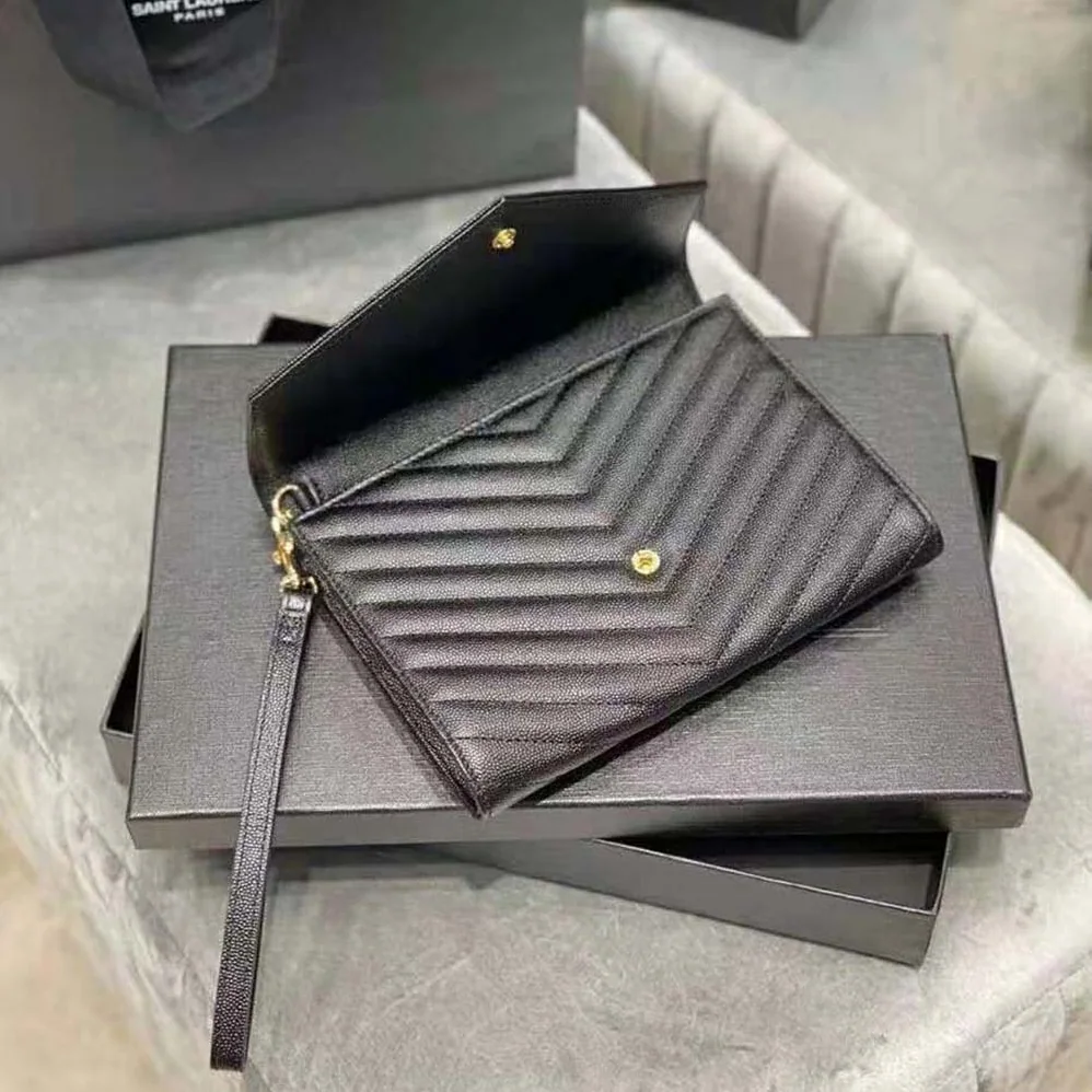 Saint Laurent YSL Monogram Clutch in Quilted Grain de Poudre Embossed Leather for Women in Black Saint Laurent YSL Monogram Clutch in Quilted Grain de Poudre Embossed Leather for Women in Black