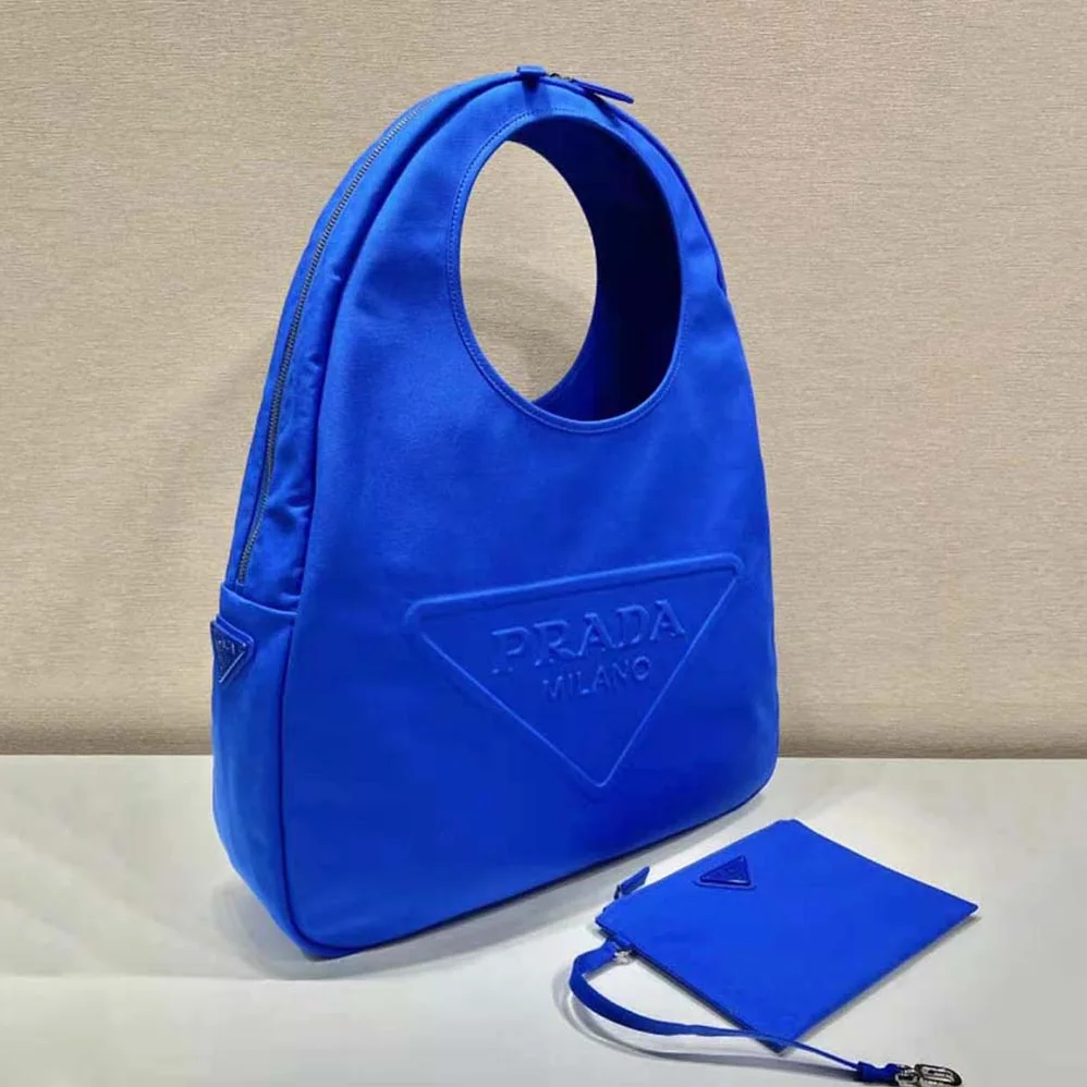 Prada Canvas Hobo Bag with Embossed Logo on the Front for Men in Blue Prada Canvas Hobo Bag with Embossed Logo on the Front for Men in Blue