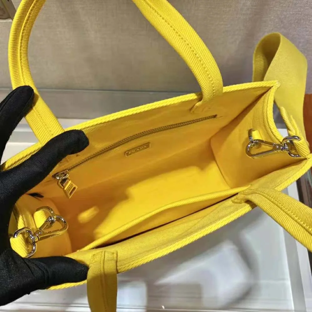 Prada Drill Tote Handles Bag for Women in Yellow Prada Drill Tote Handles Bag for Women in Yellow