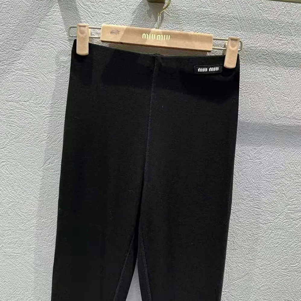 Miu Miu Silk Jersey Pants with Logo Patch for Women in Black Miu Miu Silk Jersey Pants with Logo Patch for Women in Black