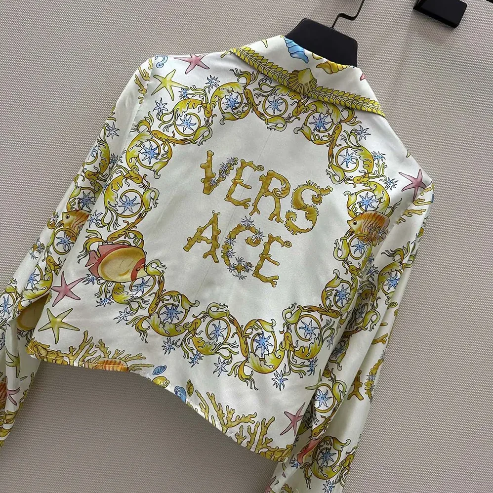 Versace Underwater Barocco Knotted Crop Silk Shirt for Women in Yellow Versace Underwater Barocco Knotted Crop Silk Shirt for Women in Yellow
