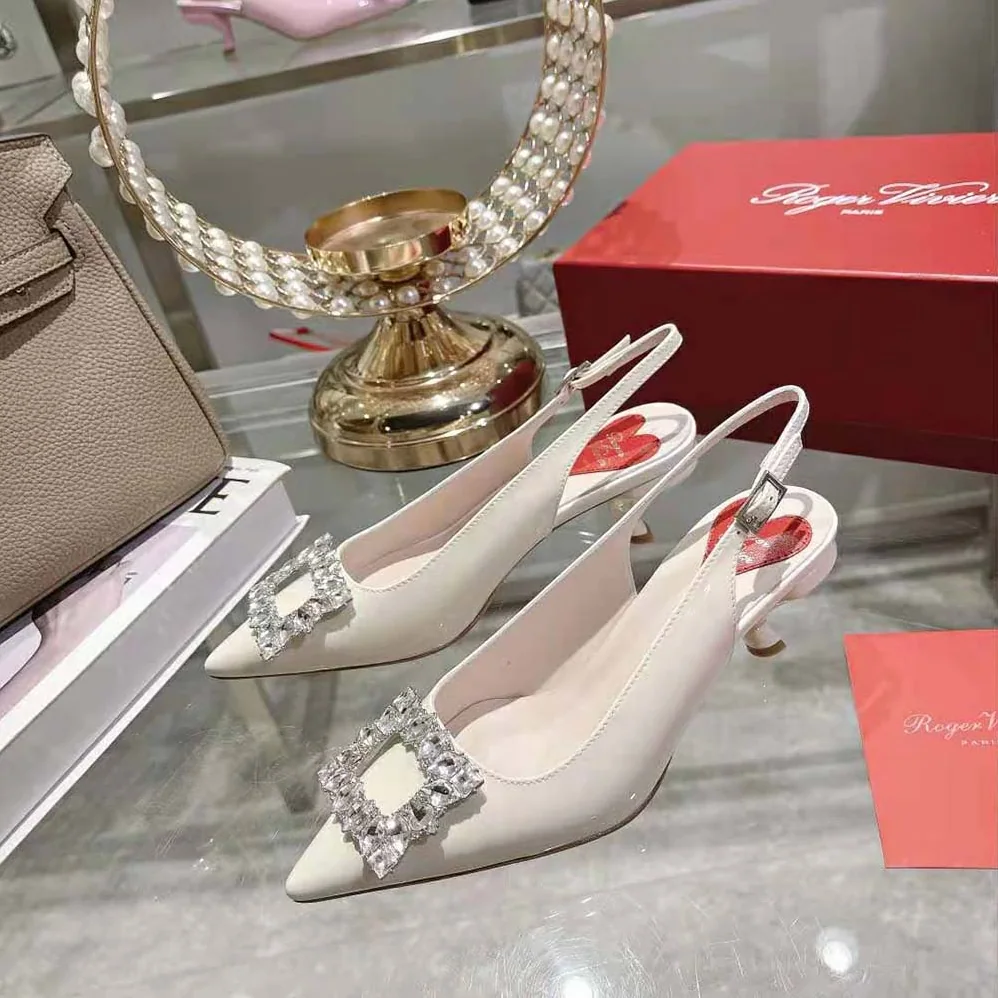 Roger Vivier Virgule Strass Buckle Slingback Pumps in Patent Leather for Women in White Roger Vivier Virgule Strass Buckle Slingback Pumps in Patent Leather for Women in White