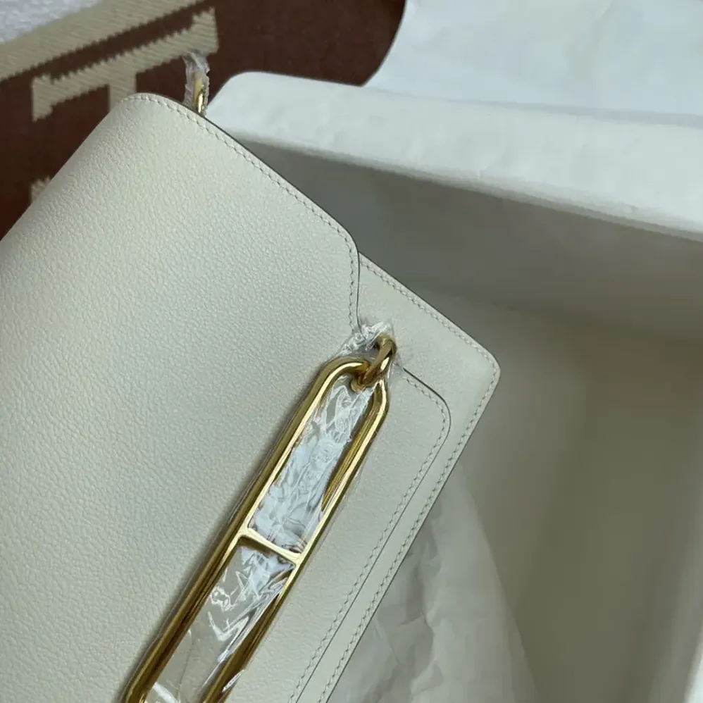 Hermes Roulis Mini Bag in Evercolor Calfskin for Women in White/Gold Hermes Roulis Mini Bag in Evercolor Calfskin for Women in White/Gold