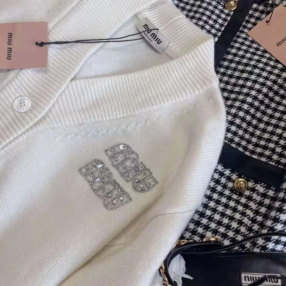Miu Miu Cashmere Cardigan Features an Embroidered Logo for Women in White Miu Miu Cashmere Cardigan Features an Embroidered Logo for Women in White