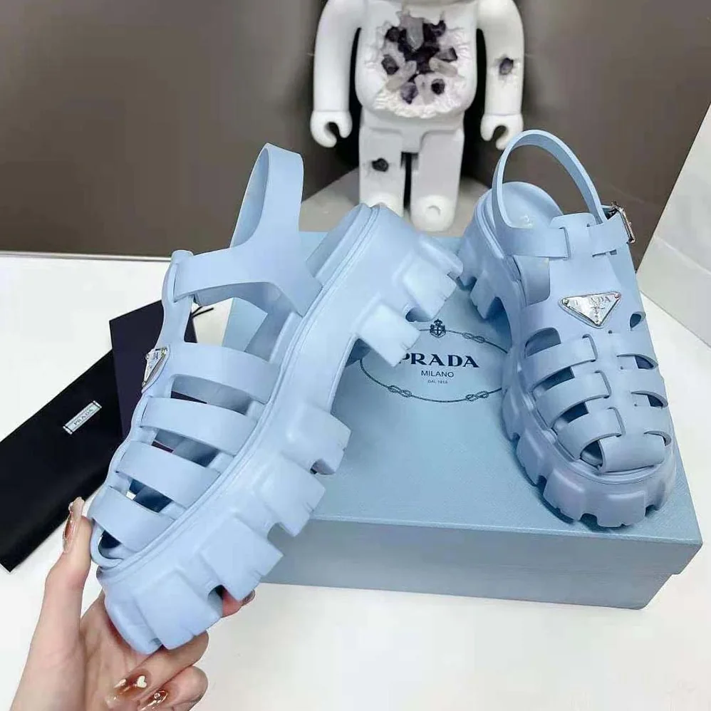 Prada Foam Rubber Sandals with Enameled Metal Triangle Logo for Women in Blue Prada Foam Rubber Sandals with Enameled Metal Triangle Logo for Women in Blue