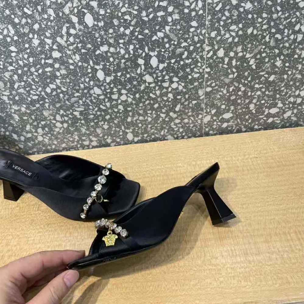 Versace Artifact Mid-Heel Mules for Women in Black Versace Artifact Mid-Heel Mules for Women in Black
