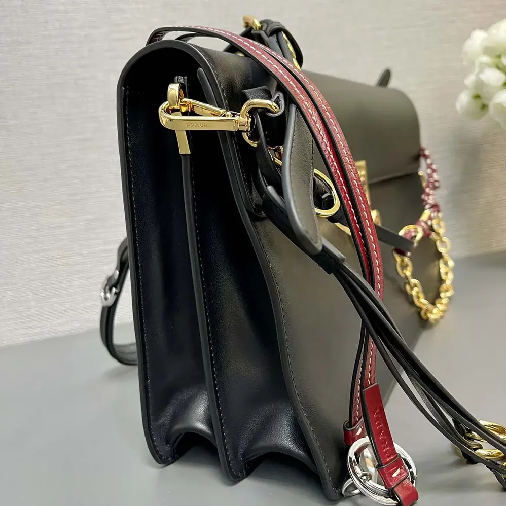 Prada Soft Sound Large Leather Shoulder Bag with Charms for Women in Black