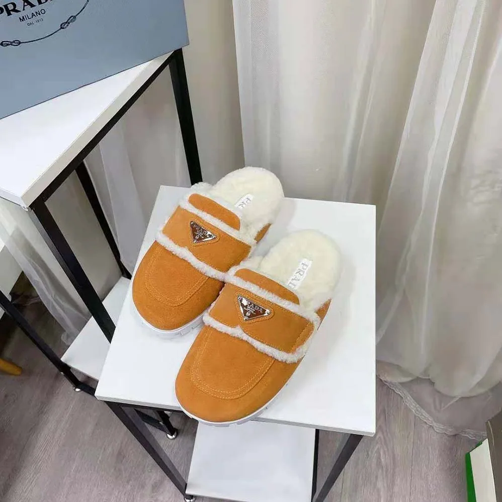 Prada Shearling Slippers Enameled Metal Triangle Logo for Women in Yellow Prada Shearling Slippers Enameled Metal Triangle Logo for Women in Yellow
