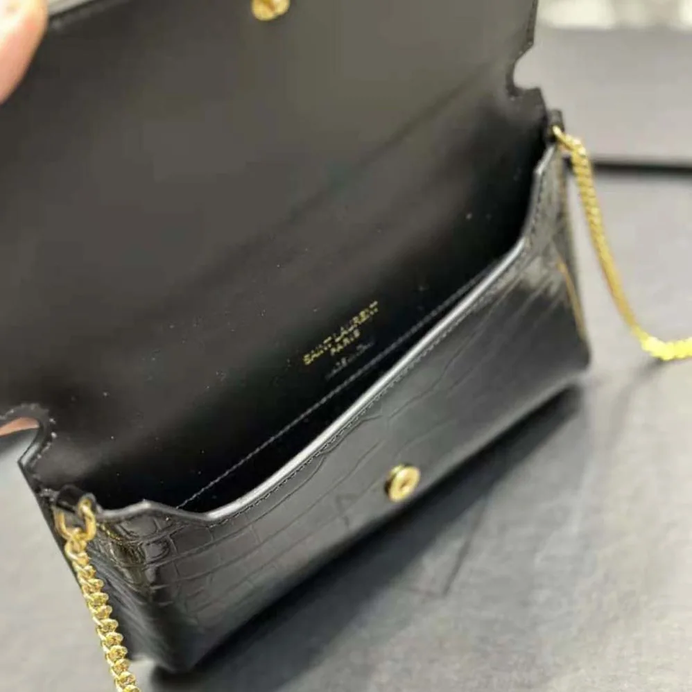 Saint Laurent YSL Cassandre Phone Holder with Strap in Shiny Crocodile-Embossed Leather for Women in Black Saint Laurent YSL Cassandre Phone Holder with Strap in Shiny Crocodile-Embossed Leather for Women in Black
