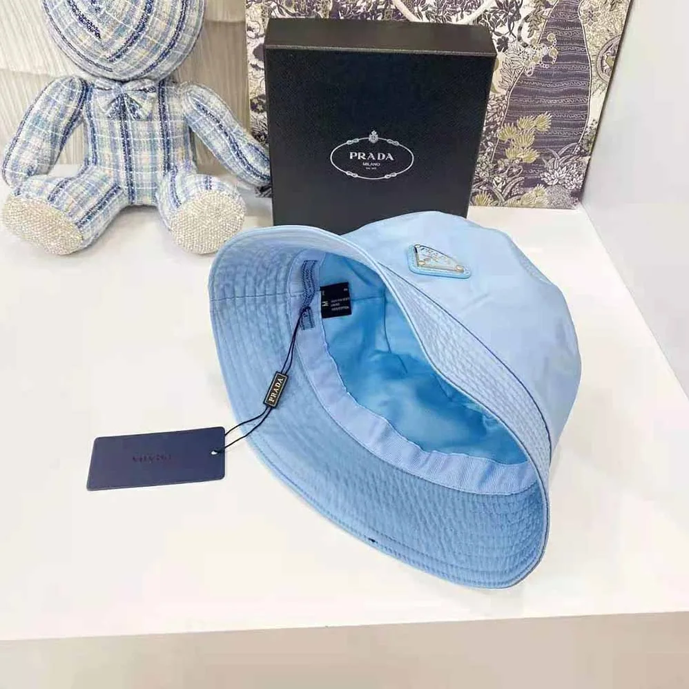 Prada Nylon Bucket Hat Decorated with the Triangle Logo for Women in Blue Prada Nylon Bucket Hat Decorated with the Triangle Logo for Women in Blue