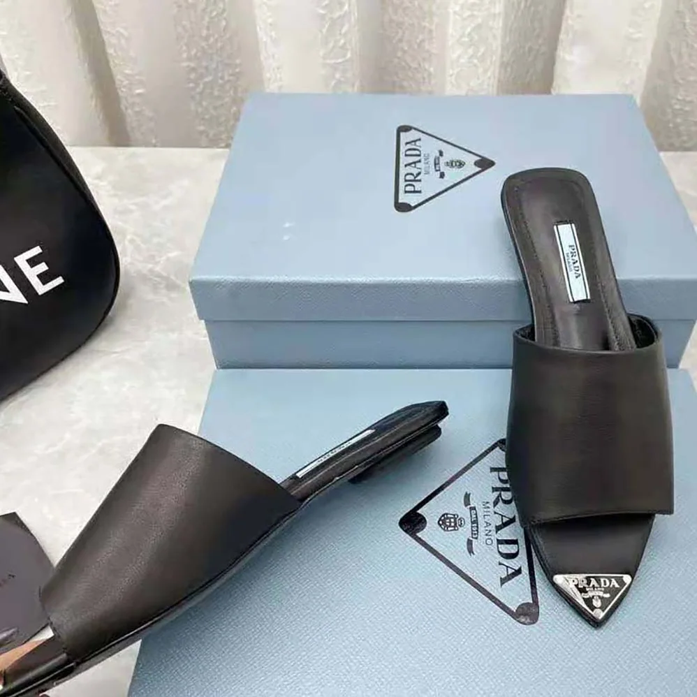 Prada Brushed Leather Slides with a Modernist Line Feature an Unexpected for Women