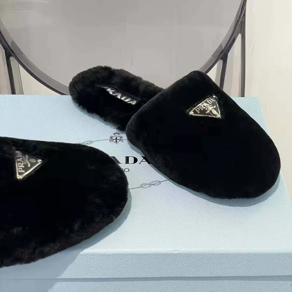 Prada Enameled Triangle Logo Accentuates Shearling Sabots for Women