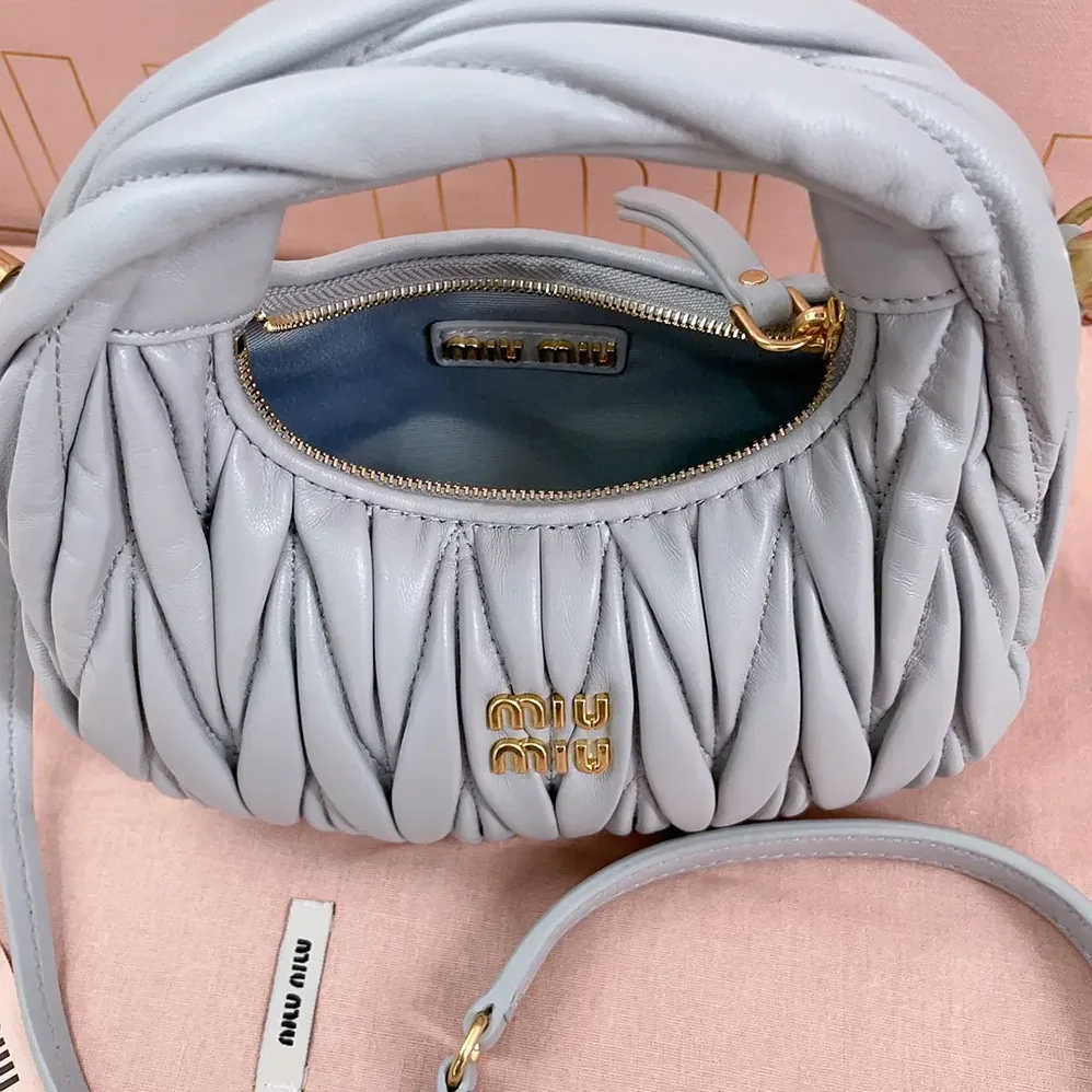 Miu Miu Wander Matelassé Nappa Leather Hobo Mini-Bag for Women in Powder Blue Miu Miu Wander Matelassé Nappa Leather Hobo Mini-Bag for Women in Powder Blue