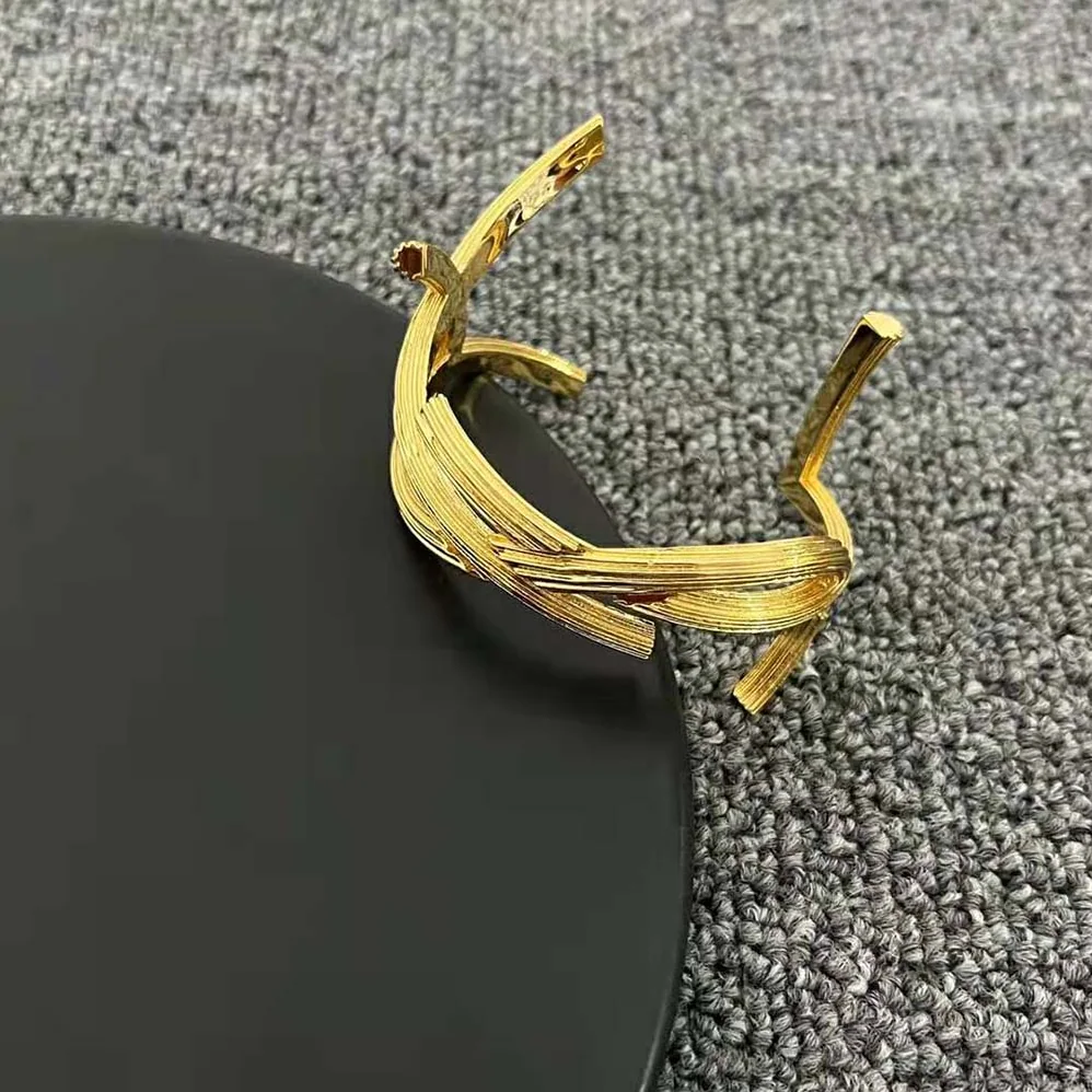 Saint Laurent YSL Opyum Twist Cuff Bracelet in Metal for Women Saint Laurent YSL Opyum Twist Cuff Bracelet in Metal for Women