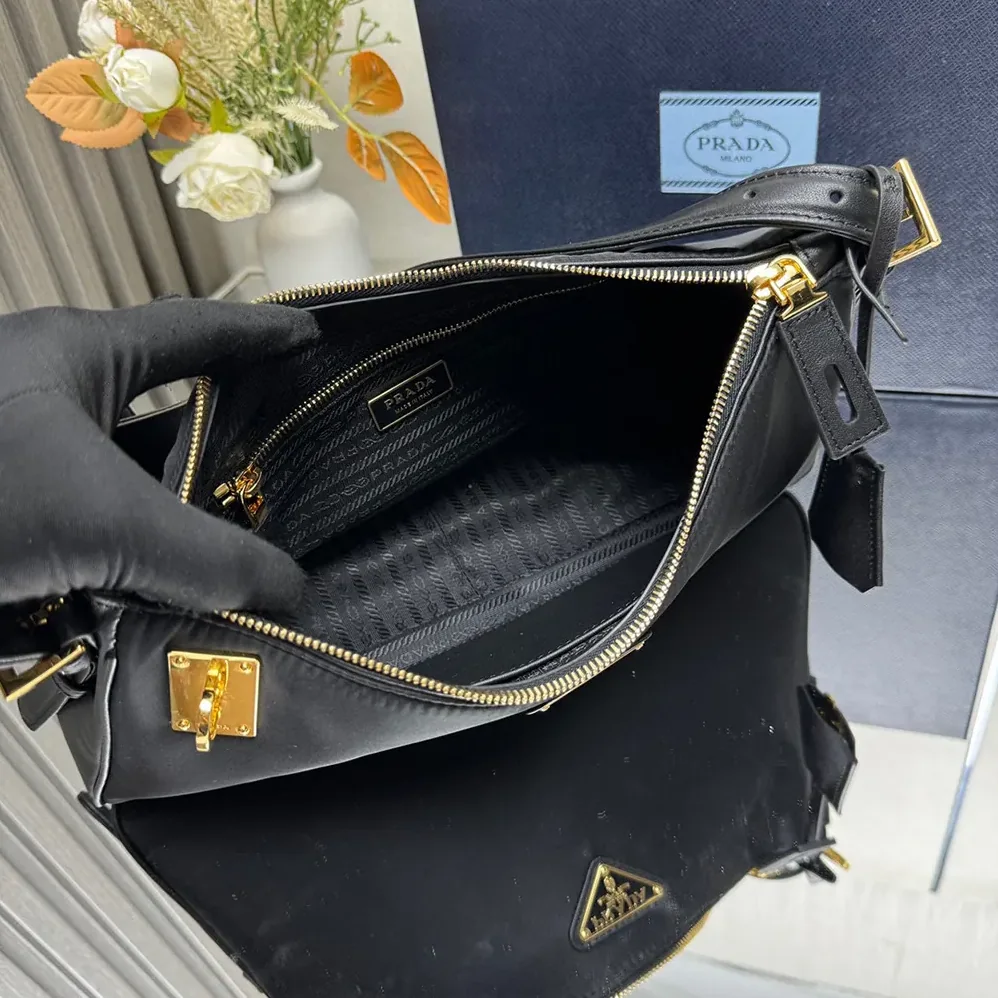 Prada Aimée large Re-Nylon and Leather Shoulder Bag with Padlock for Women Prada Aimée large Re-Nylon and Leather Shoulder Bag with Padlock for Women