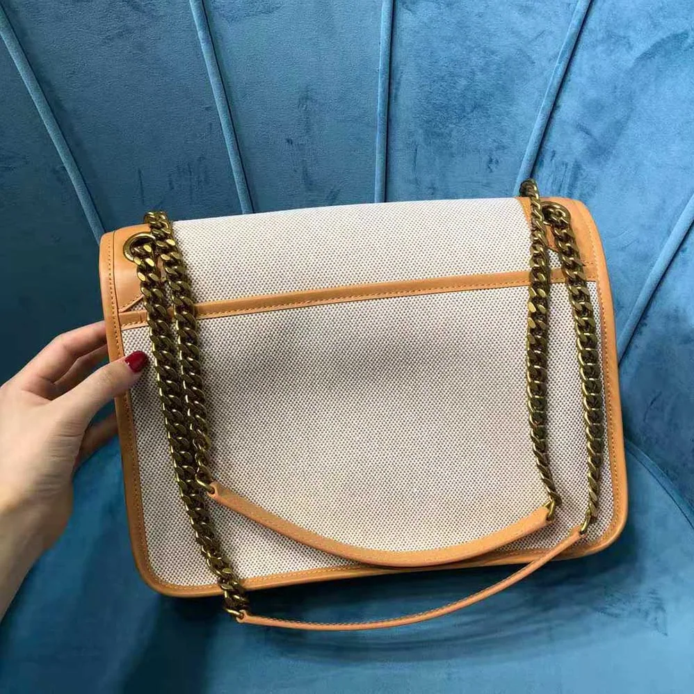 Saint Laurent YSL Niki Medium in Cotton canvas and Vintage Leather for Women Saint Laurent YSL Niki Medium in Cotton canvas and Vintage Leather for Women