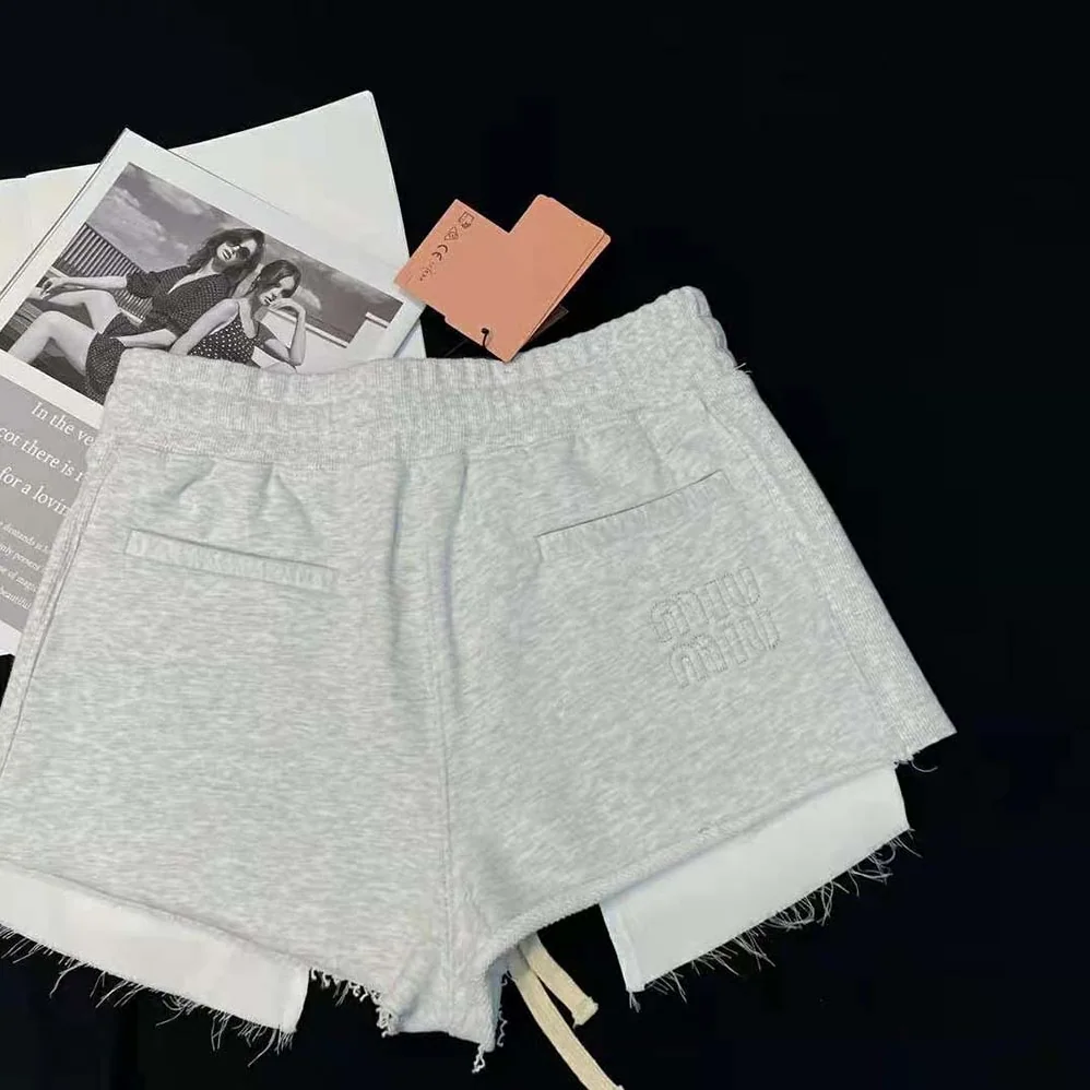 Miu Miu Embroidered Cotton Fleece Shorts for Women in Silver