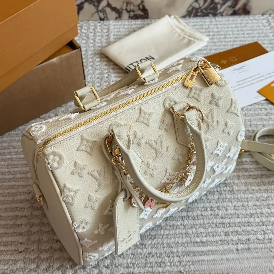 Louis Vuitton Speedy Bandouliere 25 Top Handle Bag in Cream Gold Hardware Louis Vuitton Speedy Bandouliere 25 Top Handle Bag in Cream Gold Hardware